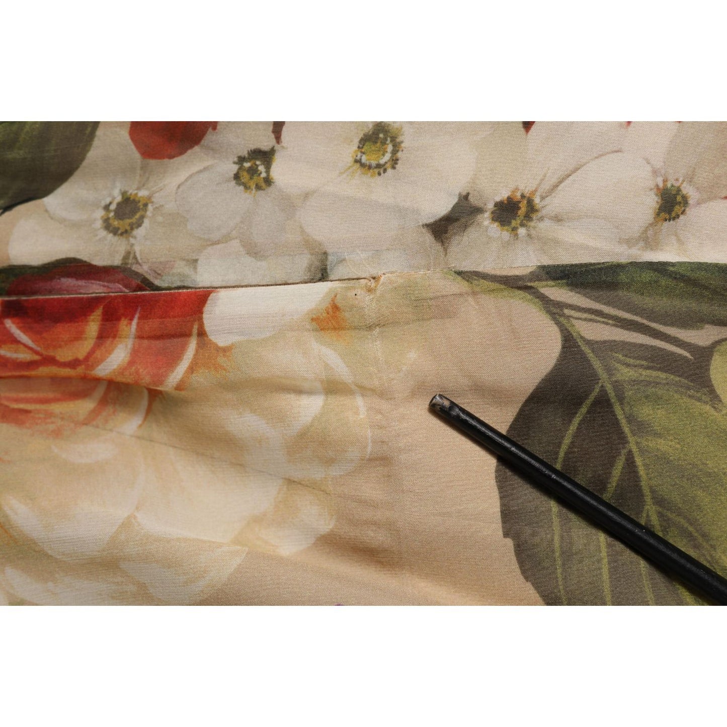 Close-up of floral pattern on Dolce & Gabbana Beige Floral Sleeveless A-line Mini Dress fabric.