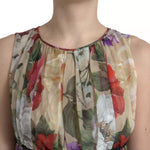 Close-up of Dolce & Gabbana Beige Floral Sleeveless A-line Mini Dress showing the delicate floral print and lightweight silk fabric.