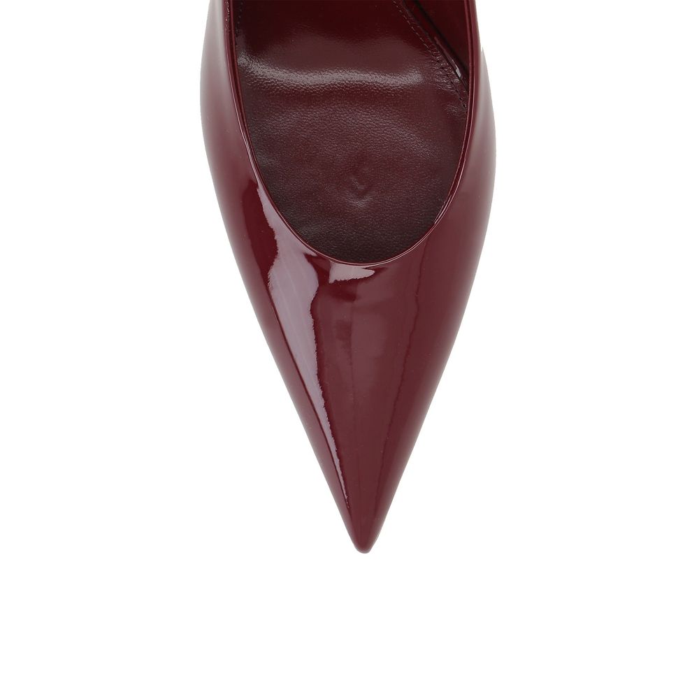 Close-up of Saint Laurent Red Calfskin Platform Pumps showing pointed toe and patent effect, women's leather shoes.
