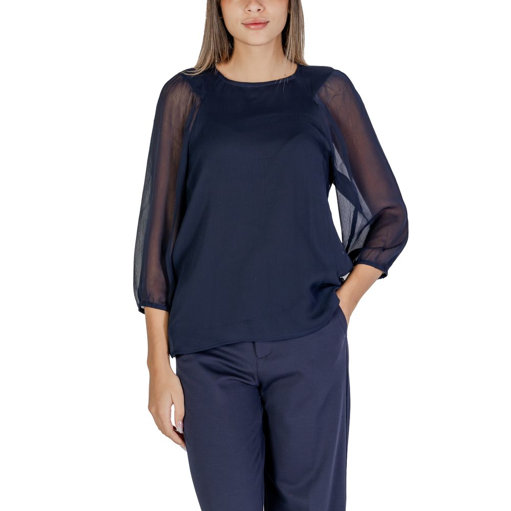 Woman wearing Street One Blue Polyester Blouse with semi-transparent sleeves and relaxed fit, ideal for casual and sophisticated outfits.