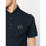 Dolce & Gabbana Logo cotton polo shirt in navy blue, featuring a logo patch on the chest, ribbed trim, and short sleeves.