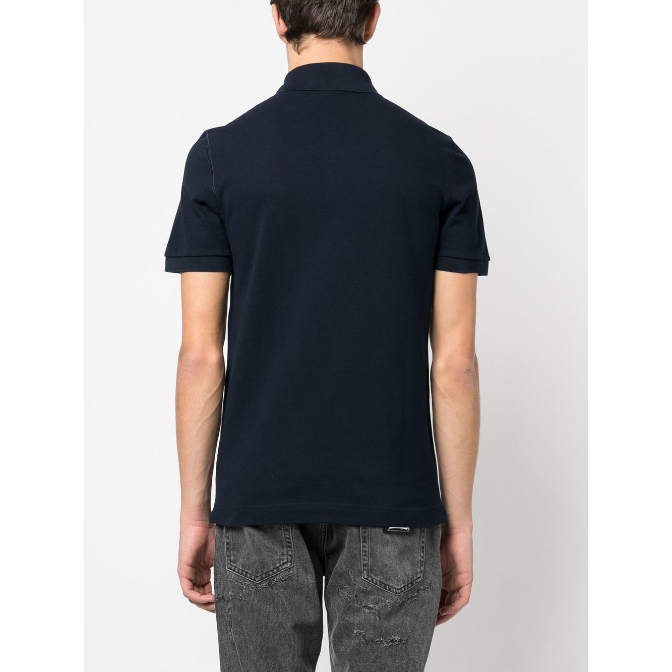 Back view of navy blue Dolce & Gabbana Logo cotton polo shirt with short sleeves and ribbed trim.