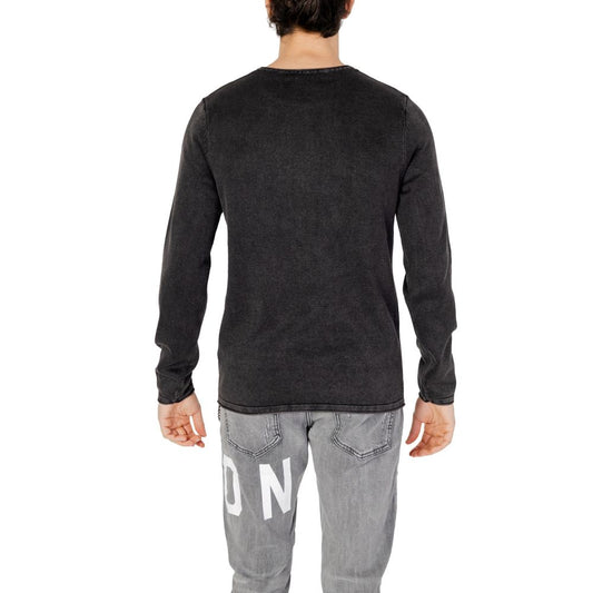 Rear view of Jack Jones Black Cotton Sportswear sweater on man, showcasing knit texture and casual style.