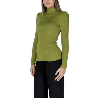 Woman wearing B.Young Green Polyester Long Sleeve T-Shirt with high neck and ribbed texture, enhancing silhouette elegantly.
