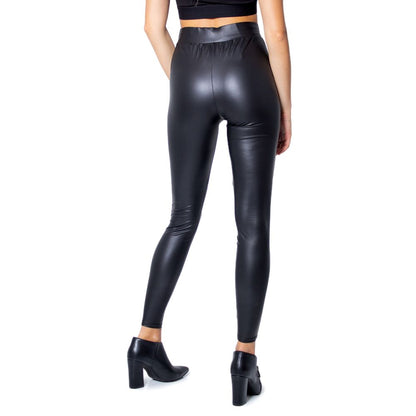 Woman wearing Only Black Polyester Leggings with glossy finish, side view, high heel shoes, showcasing curve-fitting style.