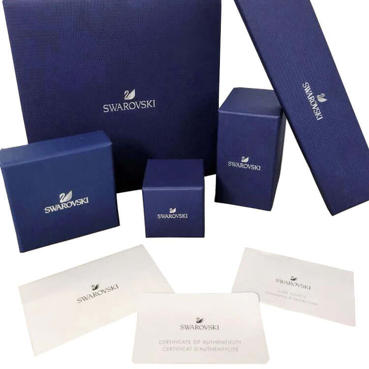 SWAROVSKI Mod. 5614926 official packaging includes blue boxes and authenticity certificate for lady's silver necklace with quartz movement.
