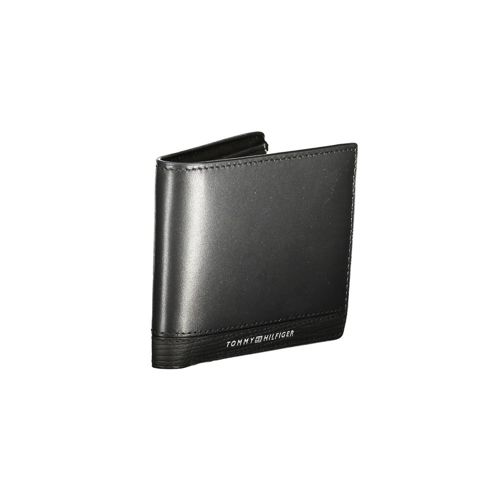 Tommy Hilfiger Black Leather Men Wallet with logo, coin purse, card slots, and contrasting details for stylish essentials.