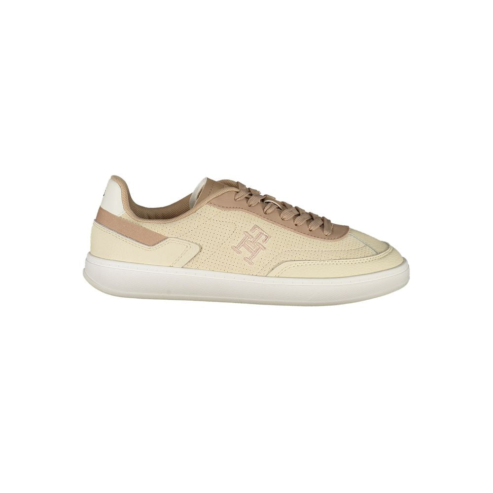 Tommy Hilfiger Beige Leather Women Sneaker, chic and versatile sports shoe with contrast details and iconic logo embroidery.