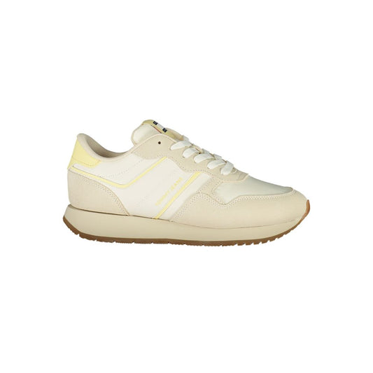 Tommy Hilfiger Beige Leather Women Sneaker with contrasting details, iconic logo, and customizable support insole for fashion-forward comfort.