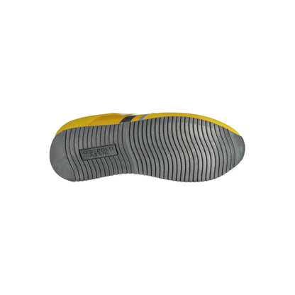 Sole of U.S. POLO ASSN. Yellow Polyester Men Sneaker showing tread design and logo.