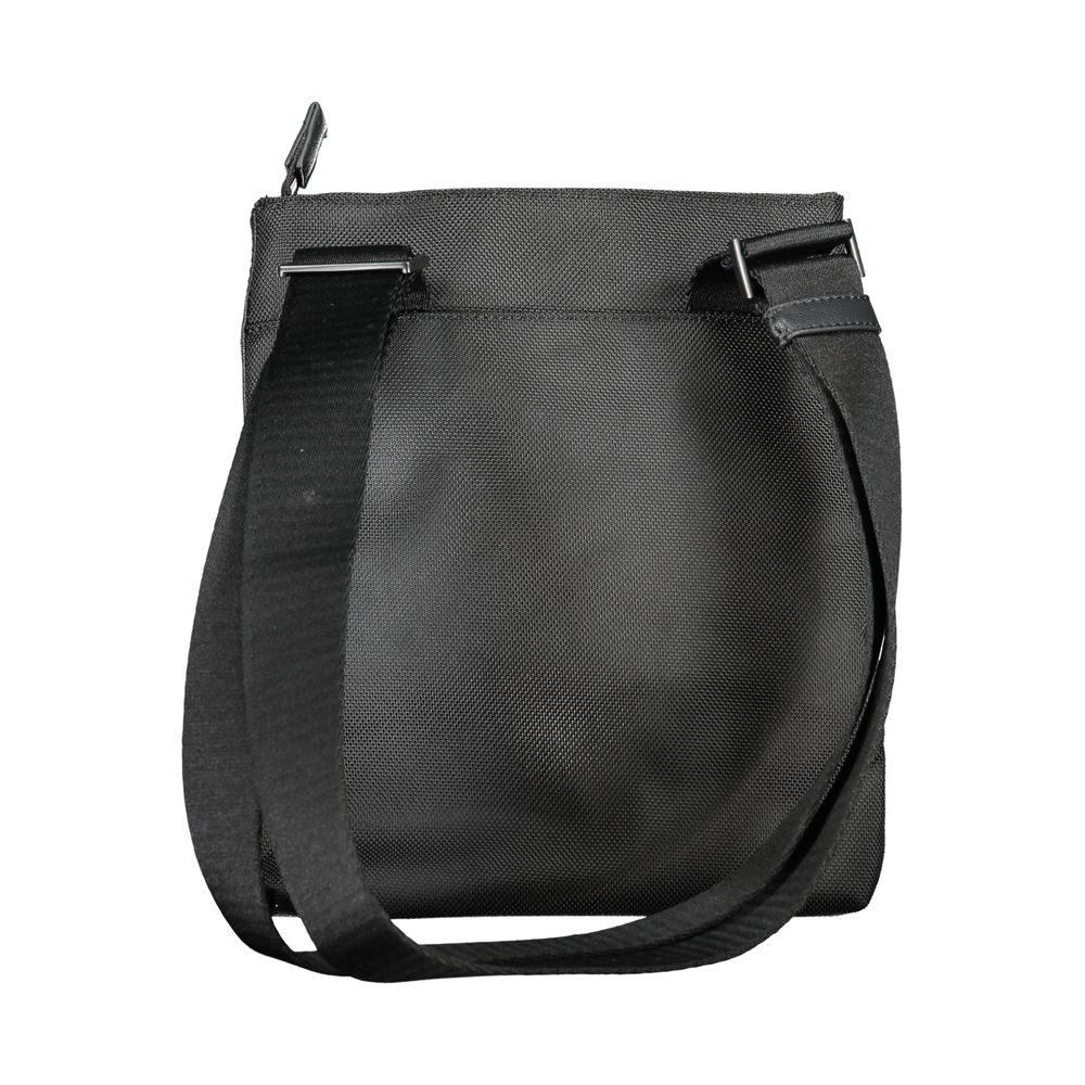 Calvin Klein Black Polyester Shoulder Bag with adjustable strap, external pocket, zip closure, and logo; 95% recycled polyester.