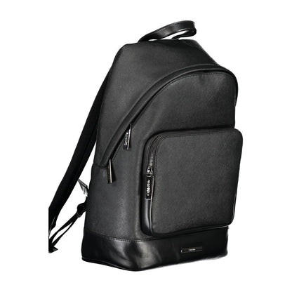 Calvin Klein Black Polyester Backpack with handle, adjustable straps, external and internal pocket, laptop compartment, and zip closure.