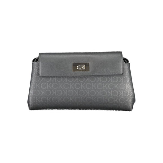 Calvin Klein Black Polyester Handbag with adjustable shoulder strap and snap closure, featuring contrasting details and internal pocket.