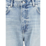 Close-up of 7FOR Bakersfield Modern straight Jeans with straight leg and mid-rise waist, showcasing belt loops and denim texture.