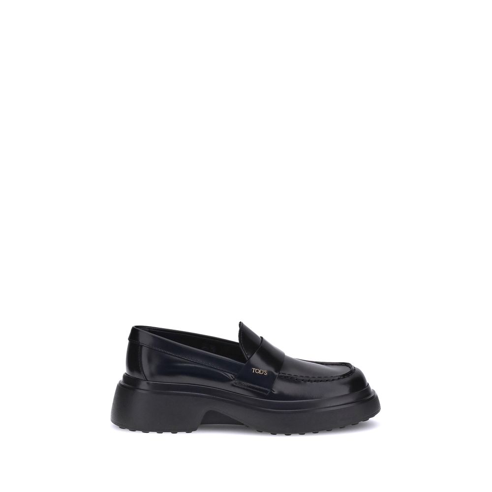 Tod's Black Rubber Platform Loafers with patent leather and rounded toe side view.
