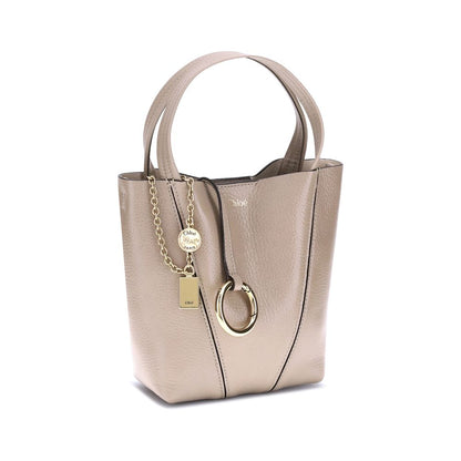Chloé Beige Calf Leather Bos Taurus Shoulder Bag with hanging chain and monogram, featuring adjustable strap and magnetic closure