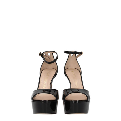 Stuart Weitzman Black Leather Platform Sandals with gold buckle, high heel, patent leather, and open toe design.