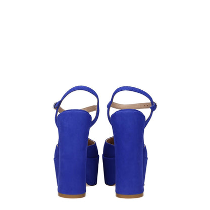 Stuart Weitzman Blue Leather Platform Sandals with buckle closure and high heel, featuring suede material and round toe design.