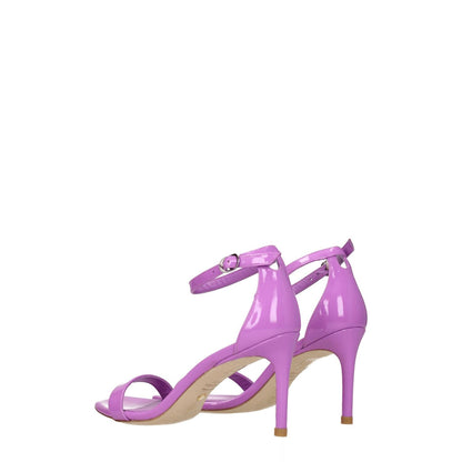 Stuart Weitzman Purple Leather Stiletto Heel Sandals with silver buckle closure, open toe, and lilac patent leather finish.