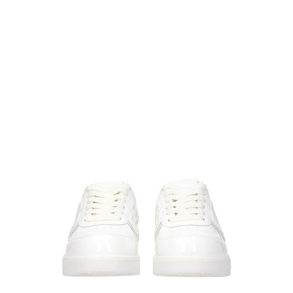 Givenchy White Leather Low Top Sneakers with front, side, and back logos, lace-up closure, rubber sole, round toe, low flat heel.