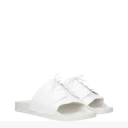 Maison Margiela White Cotton Slippers with front detail, open toe design, and rubber sole, showcasing street-style elegance.
