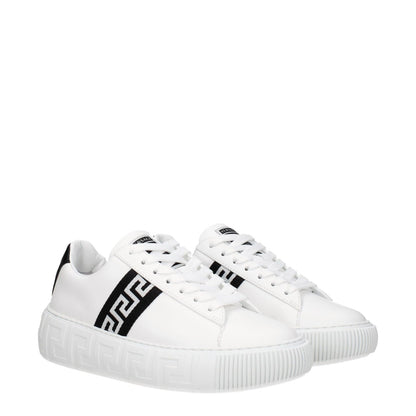 Versace White Leather Low Top Sneakers with black logo detail, lace-up closure, rubber sole, and round toe design.