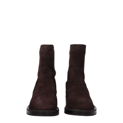 Stuart Weitzman Brown Leather Ankle Boots with a round toe and mid heels, featuring a rubber sole for casual wear.