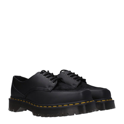 Dr. Martens Black Leather Oxfords And Derbies with rubber sole, lace-up closure, and square toe for a casual style.