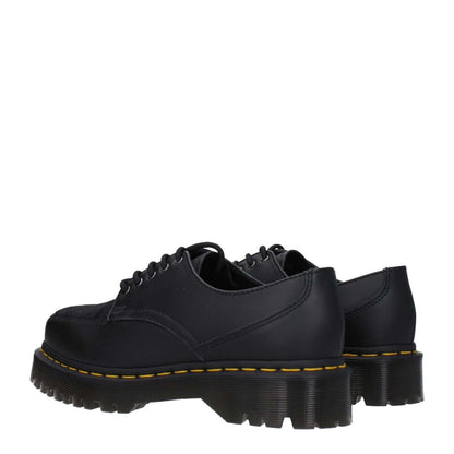 Dr. Martens Black Leather Oxfords And Derbies with lace-up design, mid heel, rubber sole, and square toe in a casual style.