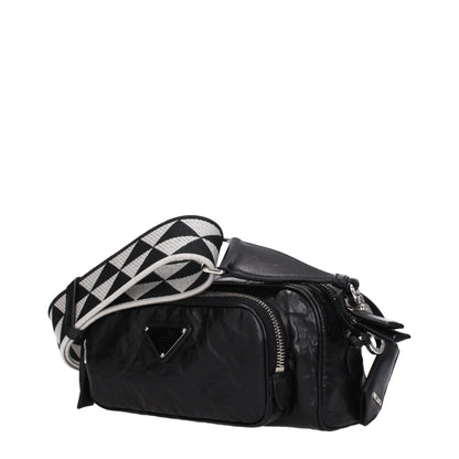Prada Black Leather Crossbody Bag with adjustable strap, silver details, and zip closure, featuring front logo and external pocket.