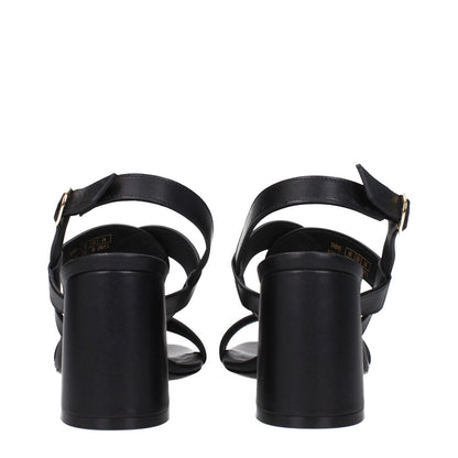 Rear view of Stuart Weitzman Black Leather Platform Sandals with buckle closure and mid heels