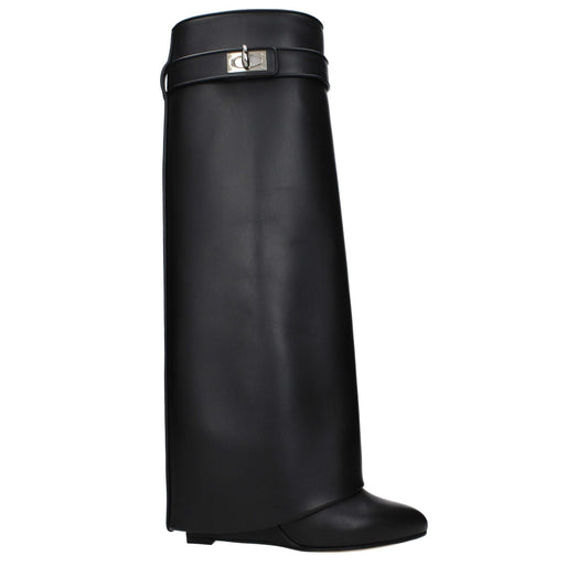 Givenchy Black Leather Boots with pointy toe, wedge heel, and side logo, featuring closure with turn lock and leather sole.