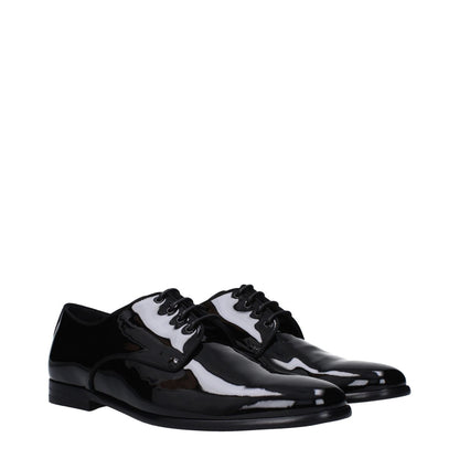 Dolce & Gabbana Black Leather Oxfords And Derbies with pointy toe, low flat heel, and lace-up closure in patent leather.