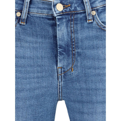 Close-up of 7FOR Blue Cotton Flared Jeans with fitted mid-rise and classic five-pocket design showcasing denim texture.