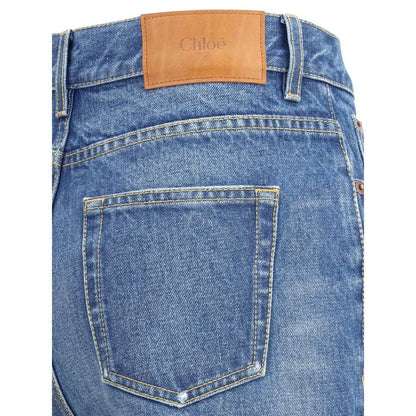 Detailed view of Chloé Blue Cotton Flared Jeans showcasing classic five-pocket design and leather brand patch on waistband