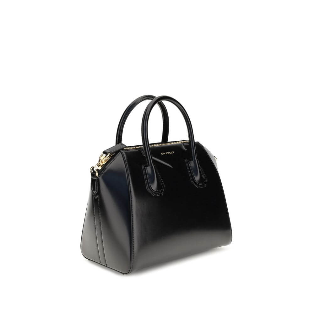 Givenchy Black Calf Leather Bos Taurus Handbag with gold accents and adjustable strap.