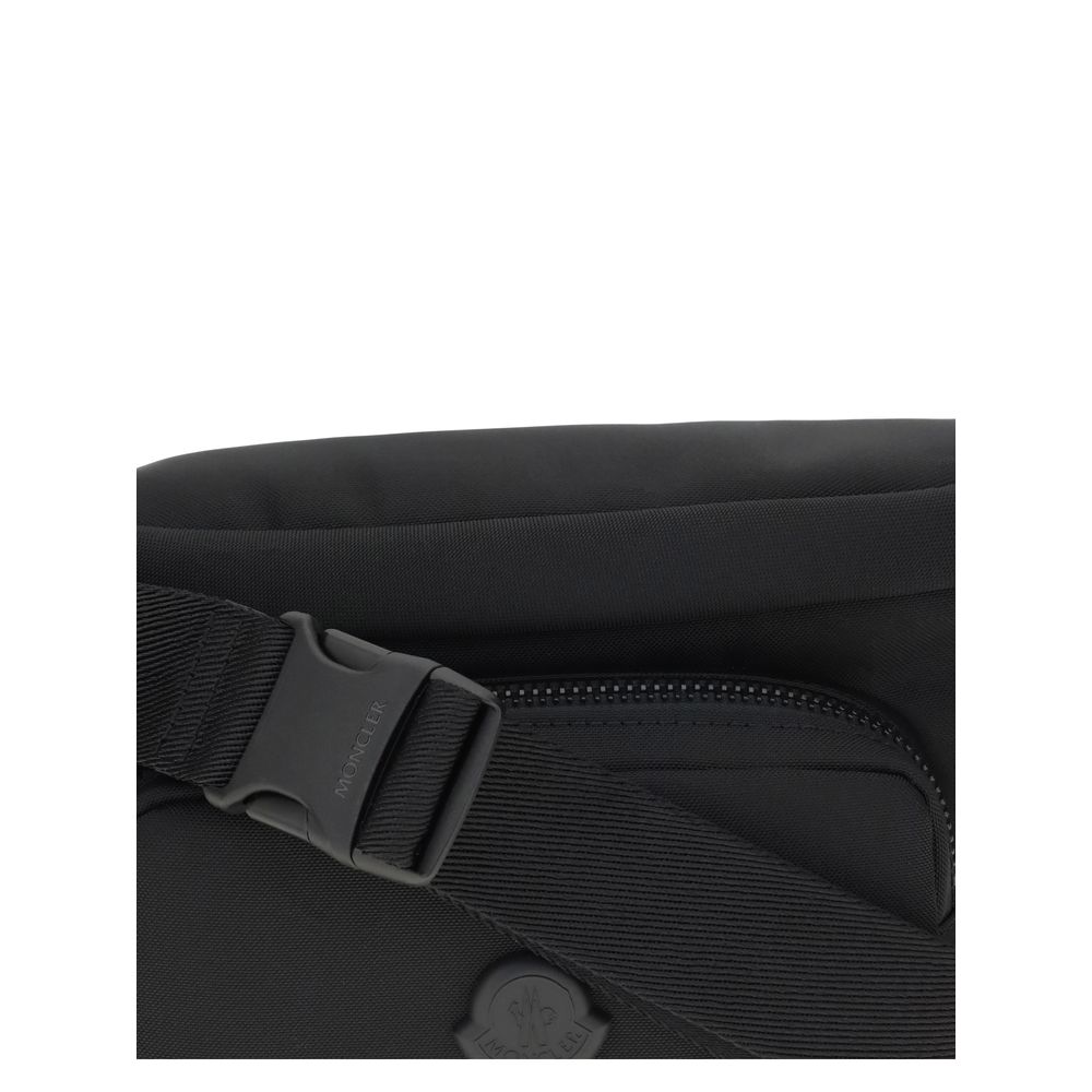 Close-up of Moncler Black Nylon Clutch Bag with adjustable belt and zippered pocket.