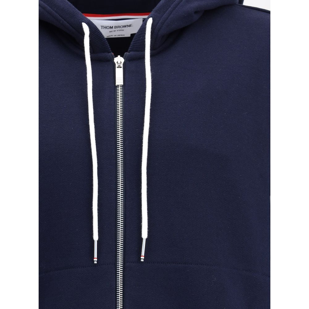 Thom Browne Blue Cotton Sweatshirt with drawstring hood and front zipper, featuring contrasting cuffs and signature patch for iconic style.