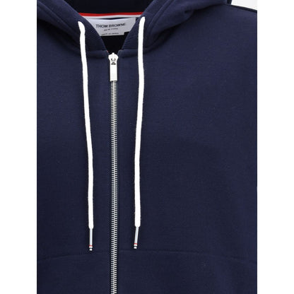 Thom Browne Blue Cotton Sweatshirt with drawstring hood and front zipper, featuring contrasting cuffs and signature patch for iconic style.