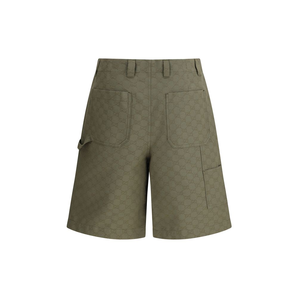 Back view of Gucci Green Cotton Bermuda Shorts with GG pattern and belt loops, showcasing a blend of heritage and modern fashion style.