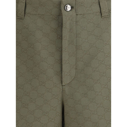 Gucci Green Cotton Bermuda Shorts showcasing GG pattern with front zipper and button closure, ideal for a casual distinctive look.
