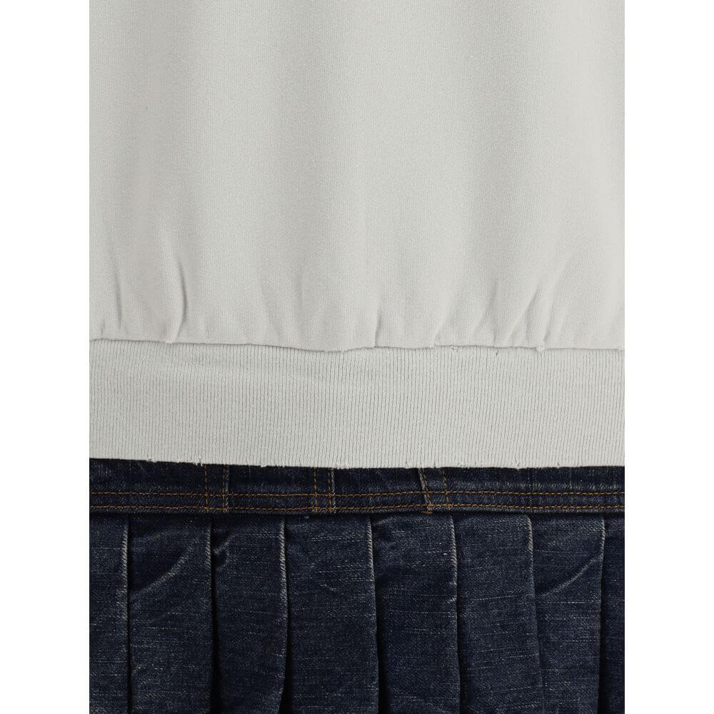 Close-up of Balenciaga Multicolor Cotton Sweatshirt with denim pleated skirt detail highlighting the unique design and texture.
