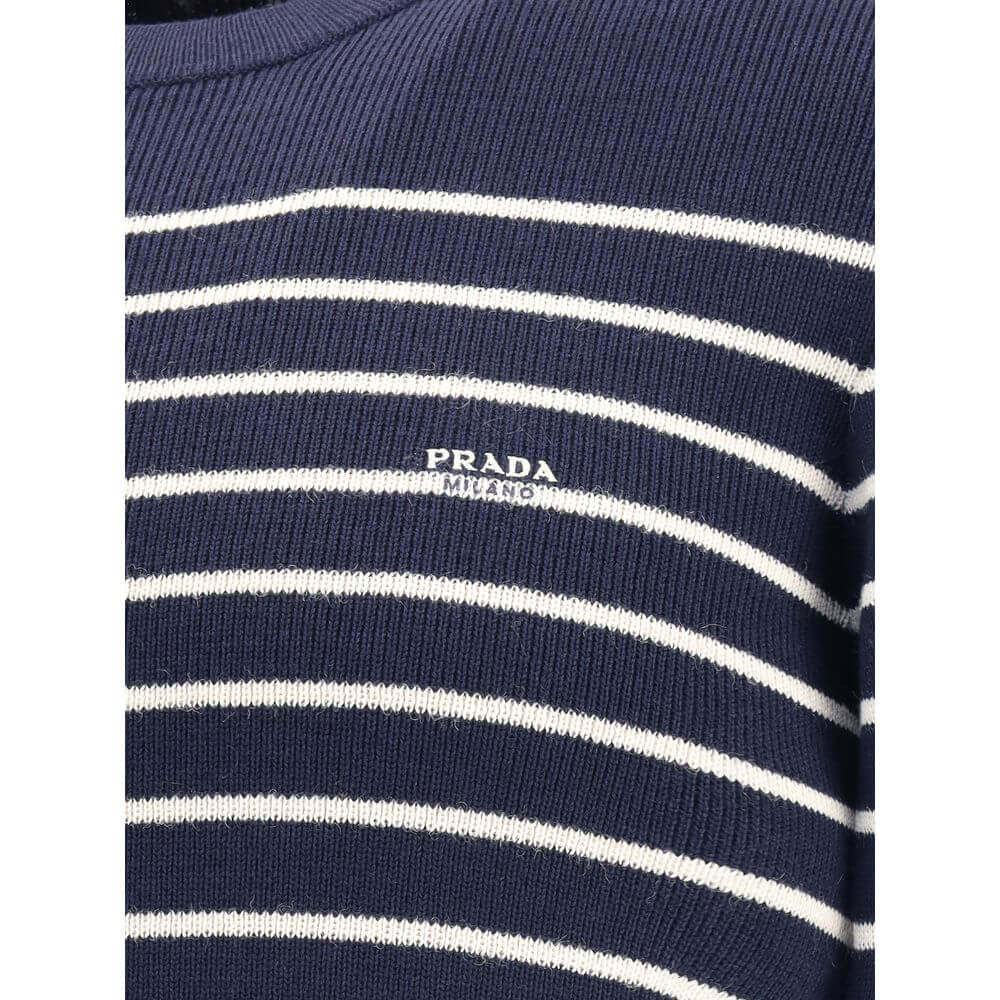 Close-up of Prada Blue Fleece Wool Sweatshirt with white stripes and iconic jacquard signature on front.
