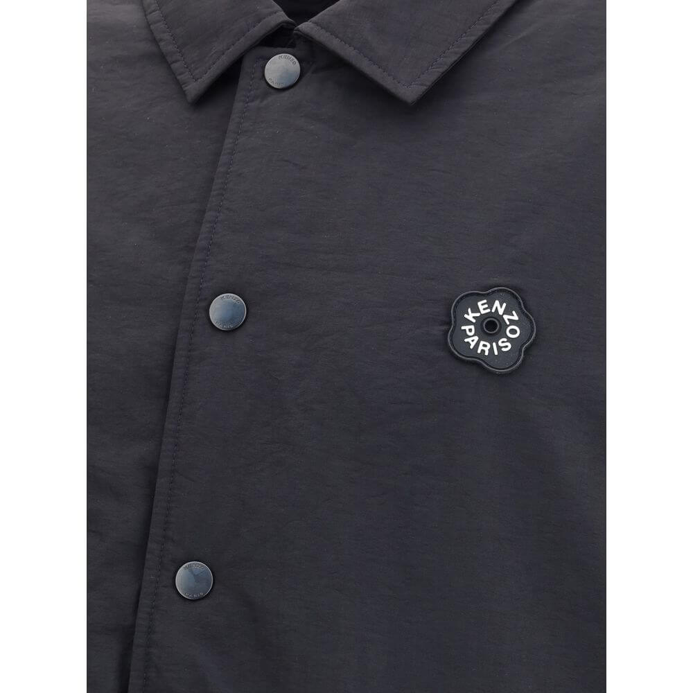 Close-up of Kenzo Black Nylon Bomber with Boke Flower 2.0 logo, showcasing matte polyester texture and metal button details.