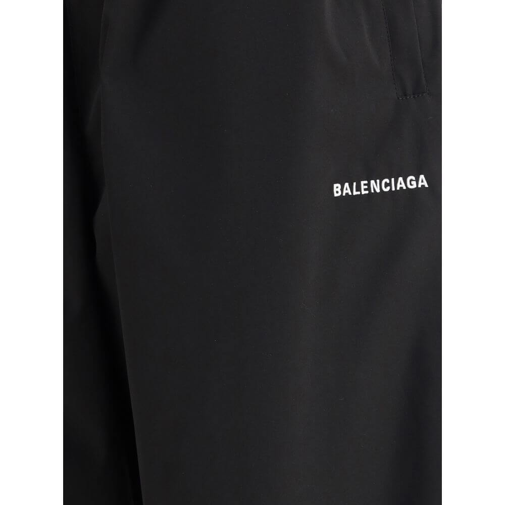 Close-up of Balenciaga Black Polyester Casual Pants showcasing the brand logo and minimalist design.