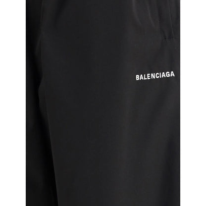 Close-up of Balenciaga Black Polyester Casual Pants showcasing the brand logo and minimalist design.