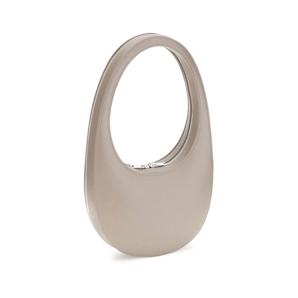 Coperni Beige Leather Shoulder Bag with unique design, hobo silhouette, top zip closure, spacious interior, and adjustable strap.