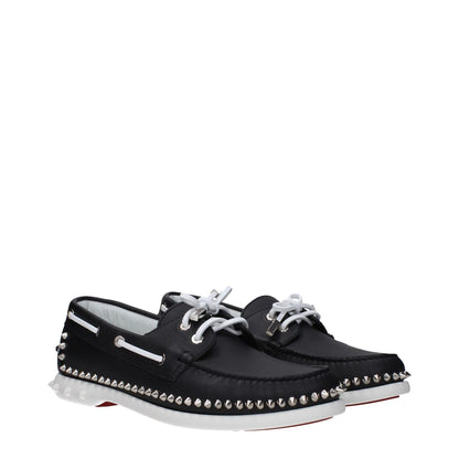 Christian Louboutin Black Leather Slip-On Loafers with studs, round toe, rubber sole, and lace-up closure; MPN 3240230BK65.