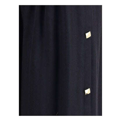 Close-up of Kristina Ti Black Fleece Wool Long Skirt with gold geometric buttons, showcasing elegant and sophisticated design.