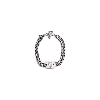 Alexander McQueen Silver Brass Bracelet featuring skull charm and engraved logo with antiqued silver chain for bold fashion statement.